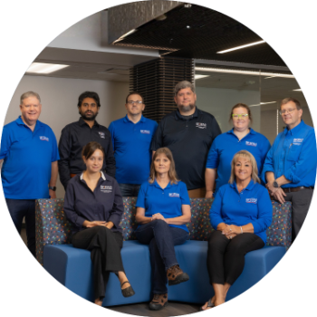 Admin and IT staff in hallway