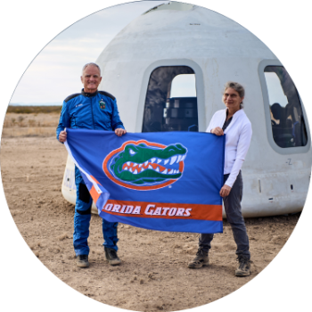 Dr. Ferl and Dr. Anna at Nasa holding UF gator banner
