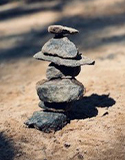 Rocks stacked on top of each other creating a rock tower. Photo by J. Schultz