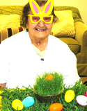 Woman with bunny glasses and easter eggs, photo by L. Fleming