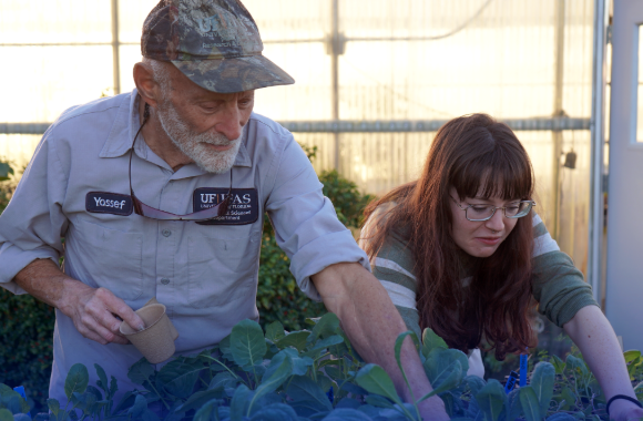 Program Overview image - couple of people working on plant